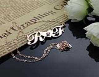 Dozens of individual initial rings comprise this necklace