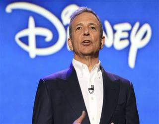 Returning CEO Bob Iger dismisses the Disney-Apple sale as "pure speculation."